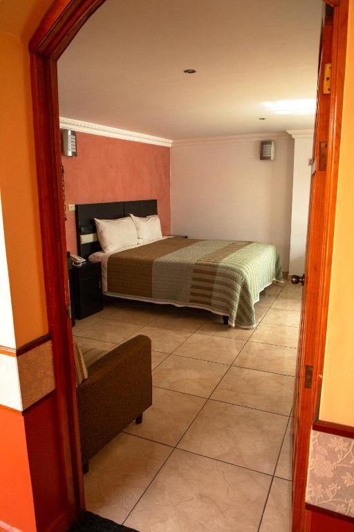 Postel nebo postele na pokoji v ubytování Hotel Posada Del Parque