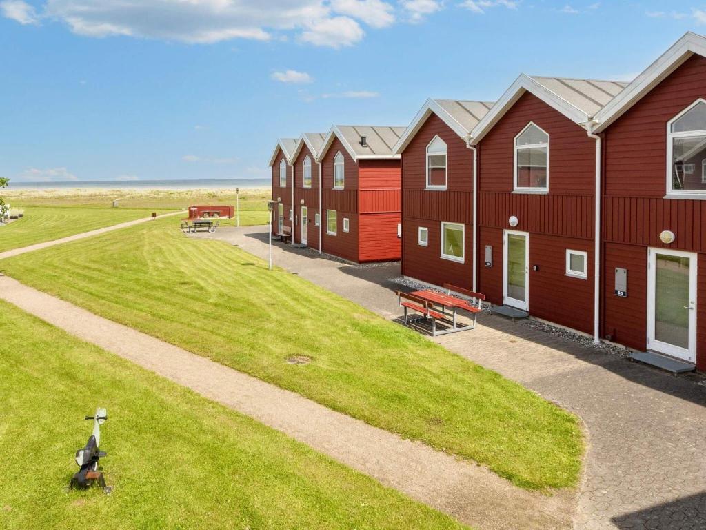 an overhead view of a row of red houses at 6 person holiday home in Hadsund-By Traum in Hadsund
