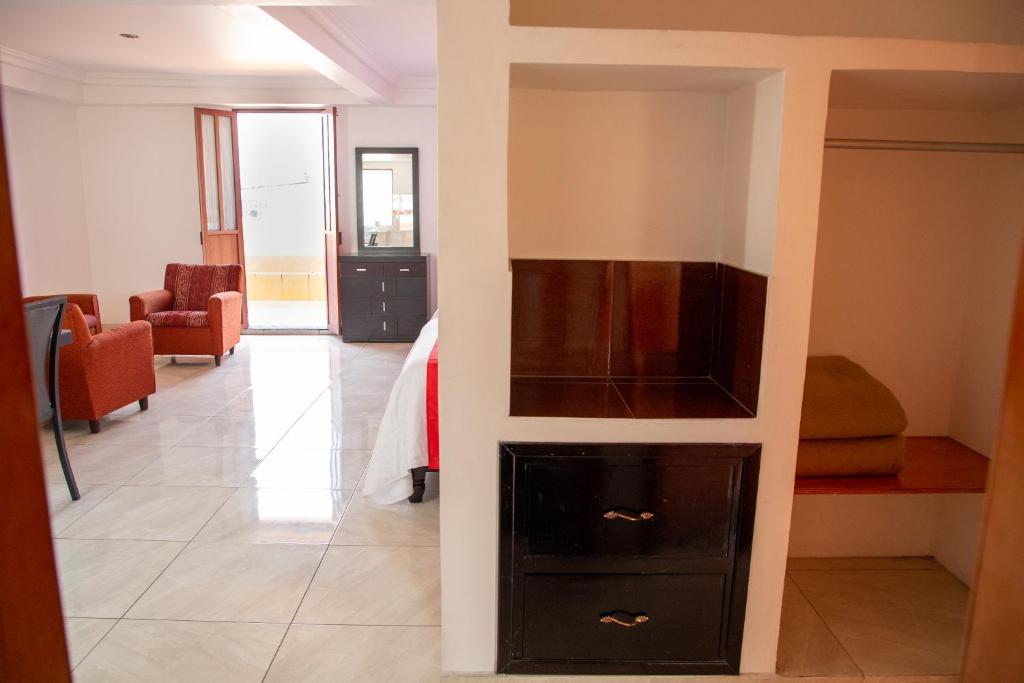 TV a/nebo společenská místnost v ubytování Hotel Posada Del Parque