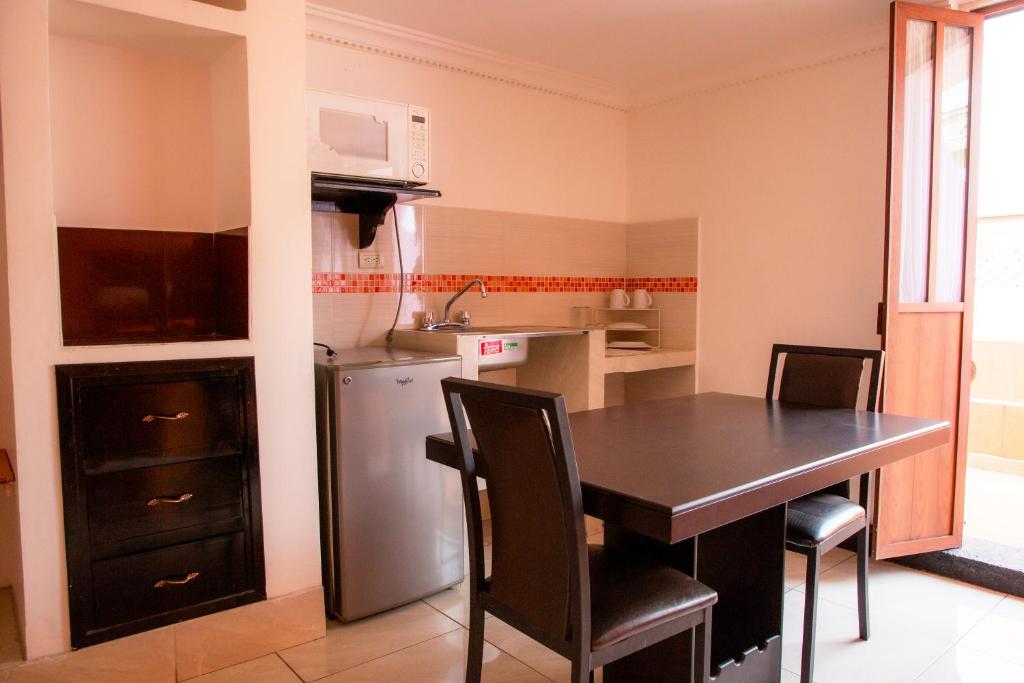 Kuchyň nebo kuchyňský kout v ubytování Hotel Posada Del Parque