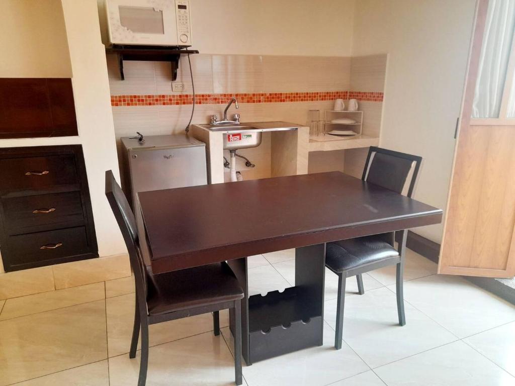 Kuchyň nebo kuchyňský kout v ubytování Hotel Posada Del Parque