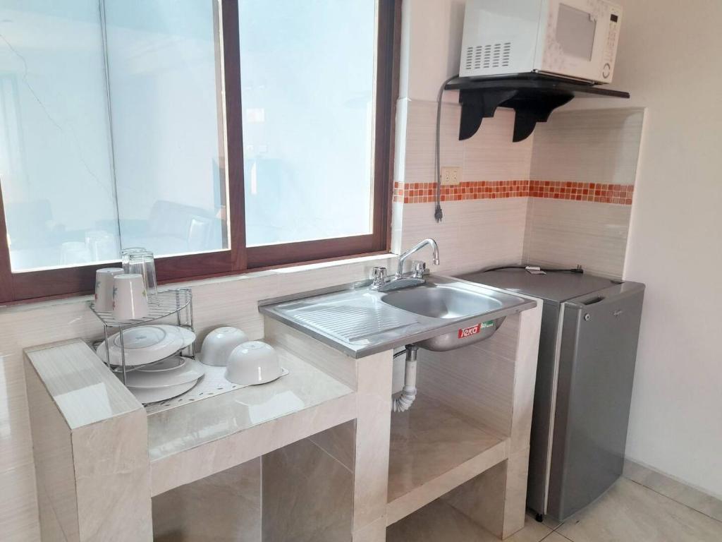 Kuchyň nebo kuchyňský kout v ubytování Hotel Posada Del Parque
