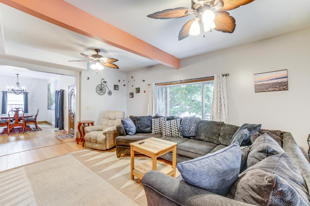 a living room with a couch and a table at Near Saugatuck Dunes Pet-Friendly Fennville Home! in Fennville
