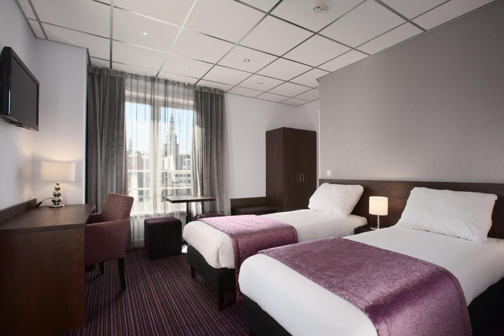 Postel nebo postele na pokoji v ubytování Hotel Luxer
