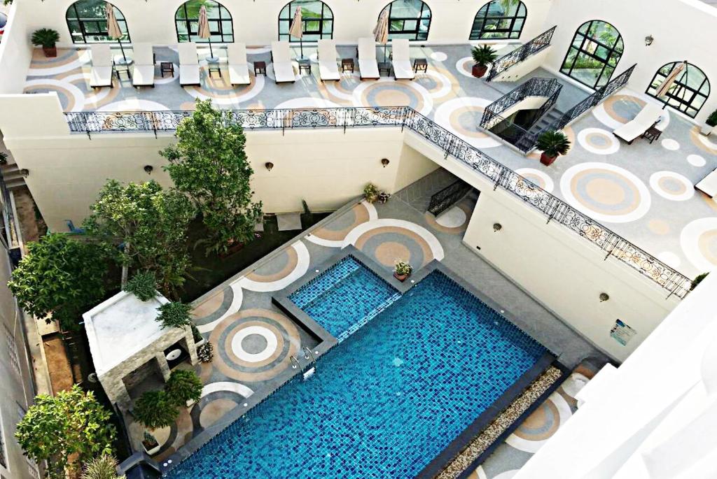 an overhead view of a pool at a resort at SN Plus Hotel - SHA Plus in Pattaya