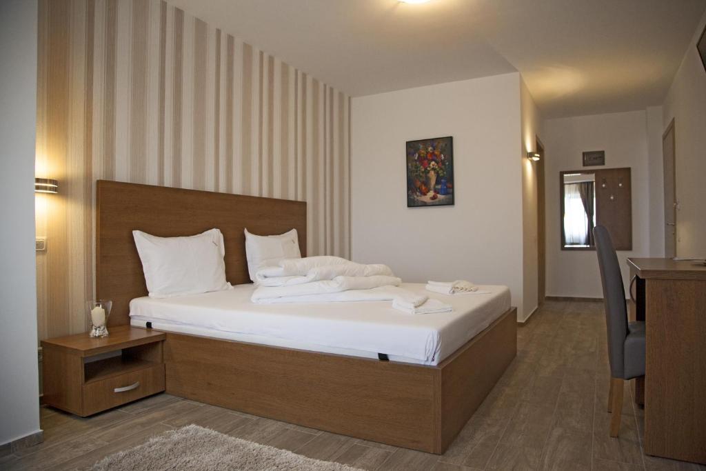 Ένα ή περισσότερα κρεβάτια σε δωμάτιο στο Hotel Nova Residence 2
