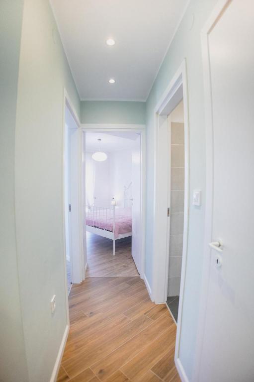 Postel nebo postele na pokoji v ubytování Valentini's Uptown Flat