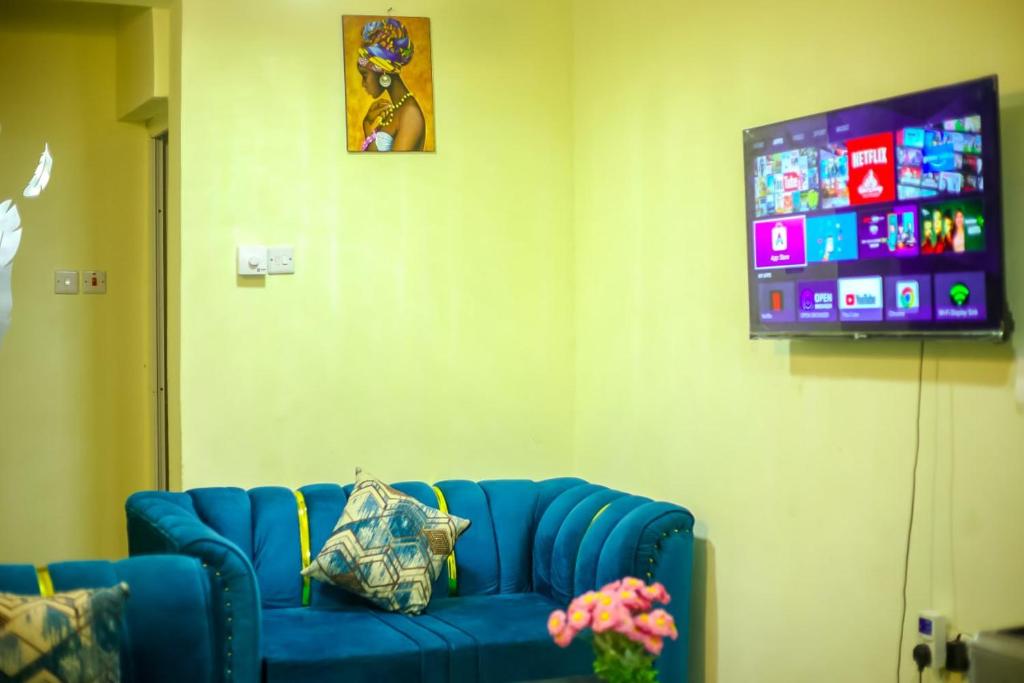 TV a/nebo společenská místnost v ubytování Vee Apartment