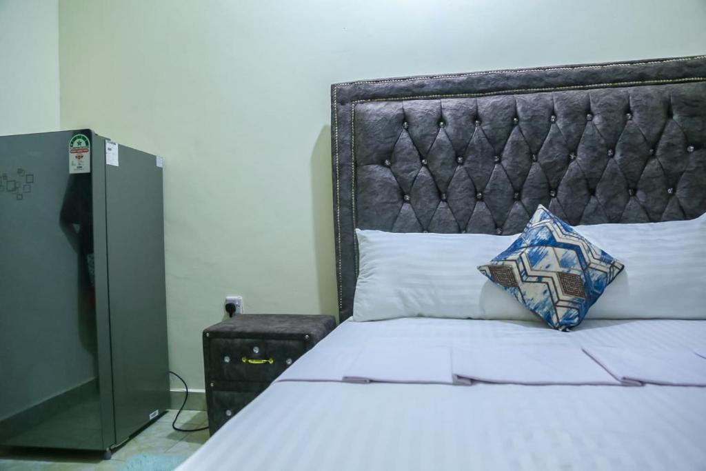 Postel nebo postele na pokoji v ubytování Vee Apartment