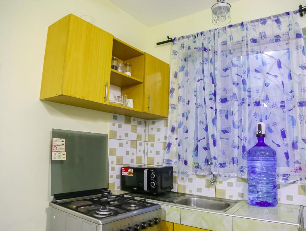 Kuchyň nebo kuchyňský kout v ubytování Vee Apartment