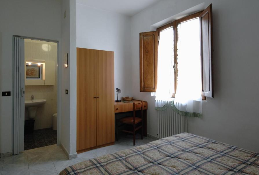 Postel nebo postele na pokoji v ubytování Albergo Imperiale