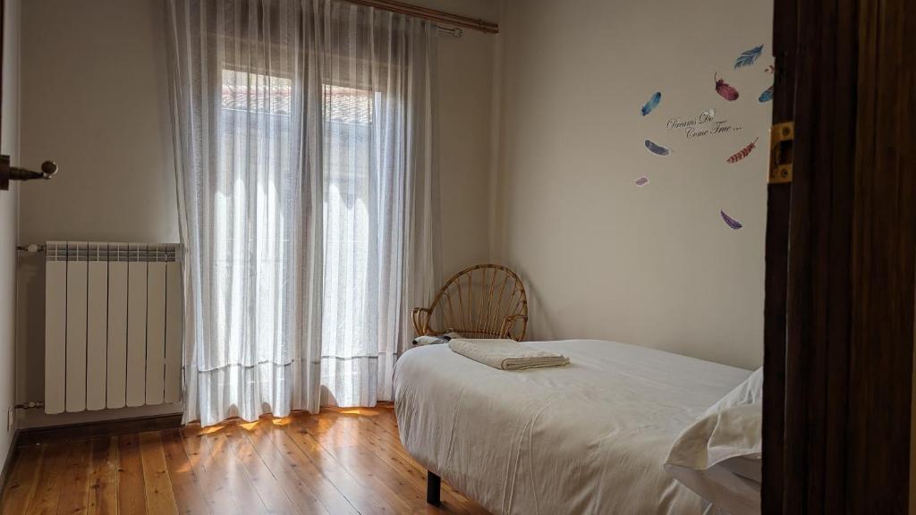 Postel nebo postele na pokoji v ubytování Apartamento Ábside de San Juan III