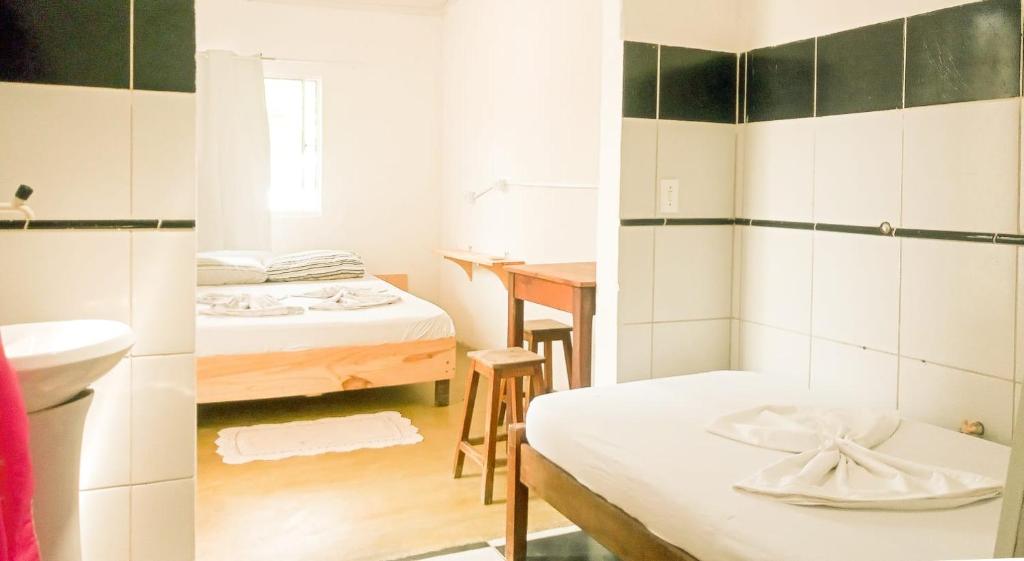 Postel nebo postele na pokoji v ubytování Hostel Jericoacoariano