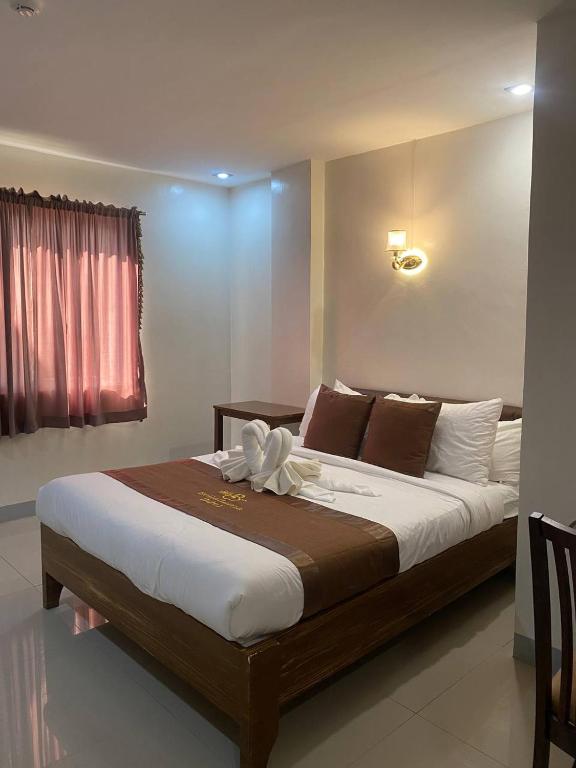 Postel nebo postele na pokoji v ubytování BELLADAMA HOTEL