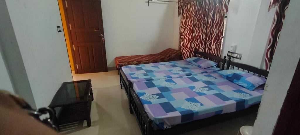 Postel nebo postele na pokoji v ubytování Prems Homestay
