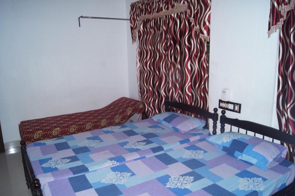 Postel nebo postele na pokoji v ubytování Prems Homestay