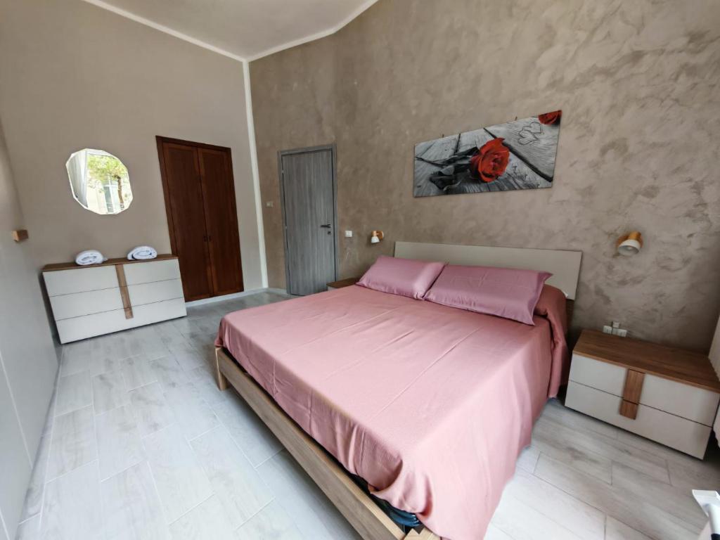 Postel nebo postele na pokoji v ubytování Domus Domy - Parcheggio privato