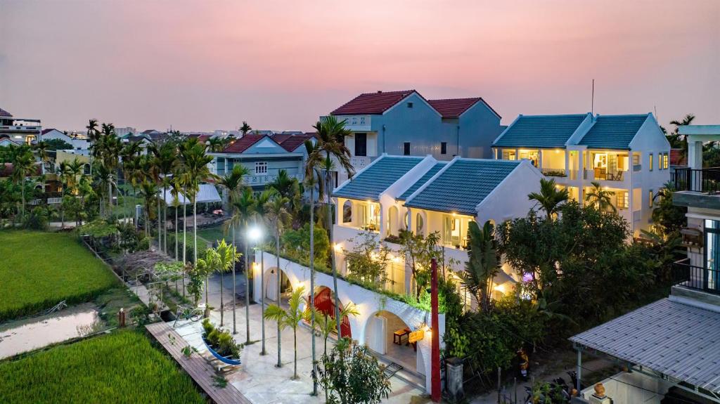 an aerial view of a resort at night at Secret House Boutique Hoi An in Hoi An