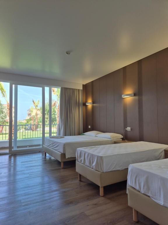 Postel nebo postele na pokoji v ubytování Suite Hotel Dominicus