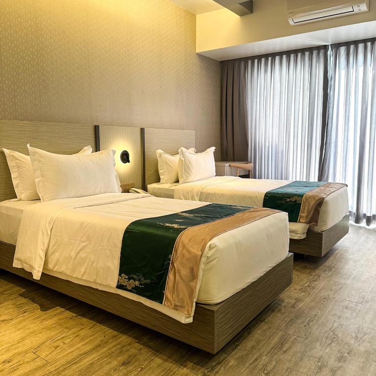 Postel nebo postele na pokoji v ubytování Badsbrotel Suites