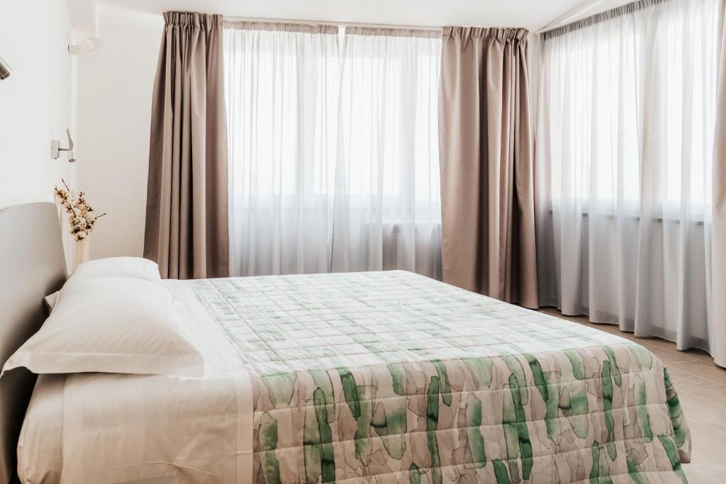 Postel nebo postele na pokoji v ubytování ALLA RIPA di RIO