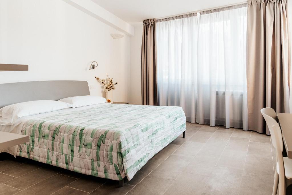 Postel nebo postele na pokoji v ubytování ALLA RIPA di RIO