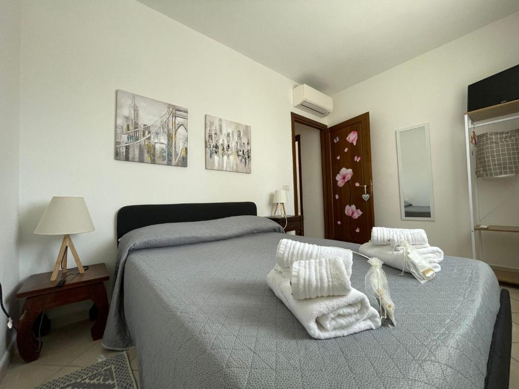 Postel nebo postele na pokoji v ubytování Wanna's Apartment Olbia