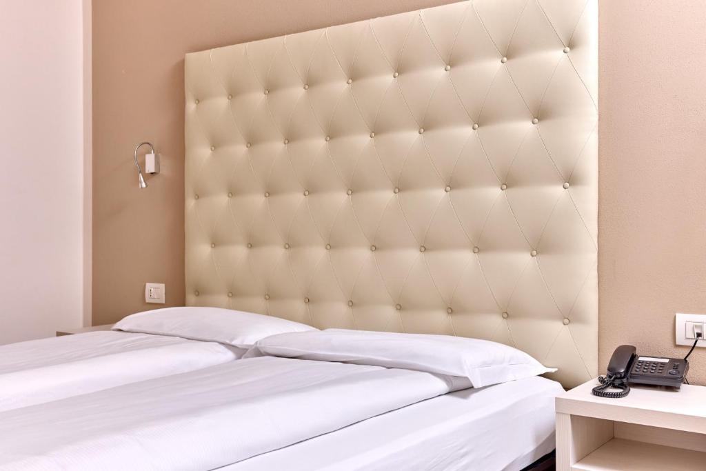 Postel nebo postele na pokoji v ubytování Hotel Geier