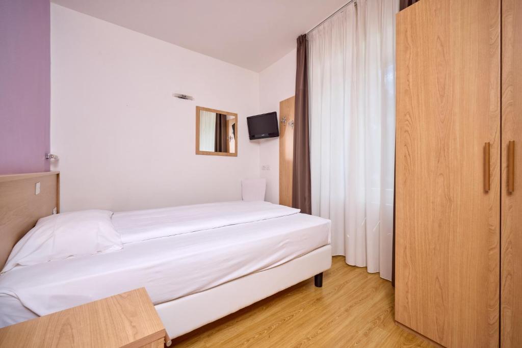 Postel nebo postele na pokoji v ubytování Hotel Geier
