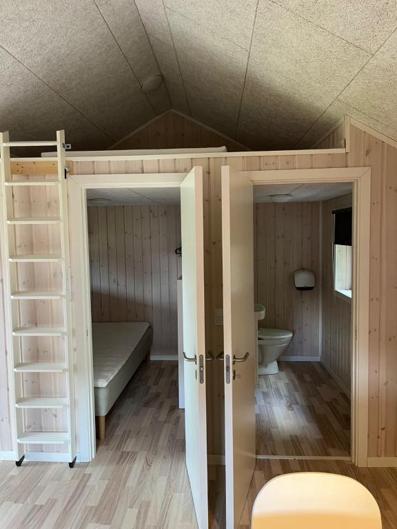 Postel nebo postele na pokoji v ubytování Holme Å Camping & Cottages