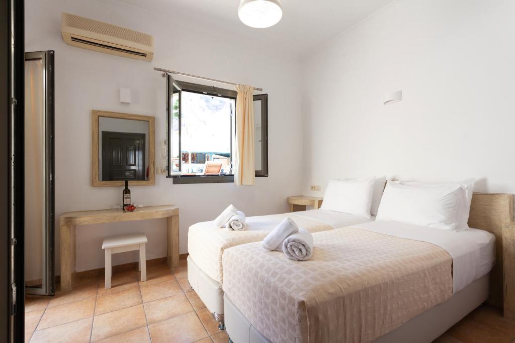 Ένα ή περισσότερα κρεβάτια σε δωμάτιο στο Phevos Villa