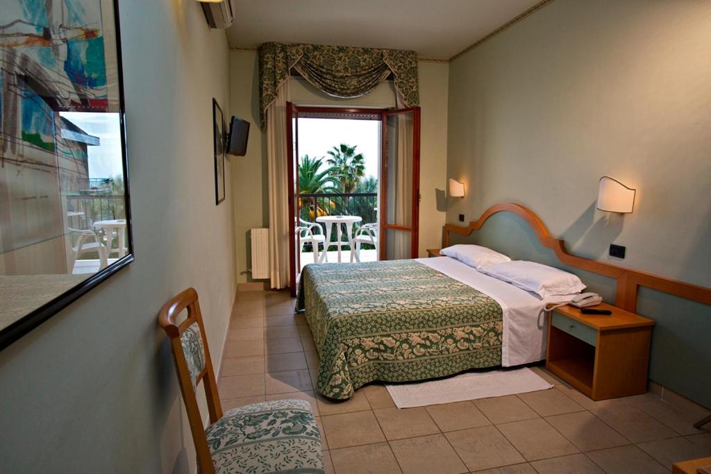Ένα ή περισσότερα κρεβάτια σε δωμάτιο στο Hotel Sayonara