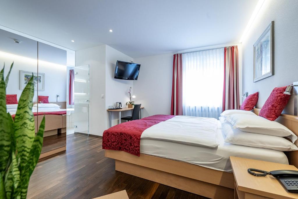 Postel nebo postele na pokoji v ubytování Hotel Vorab - Kulinarische Vielfalt