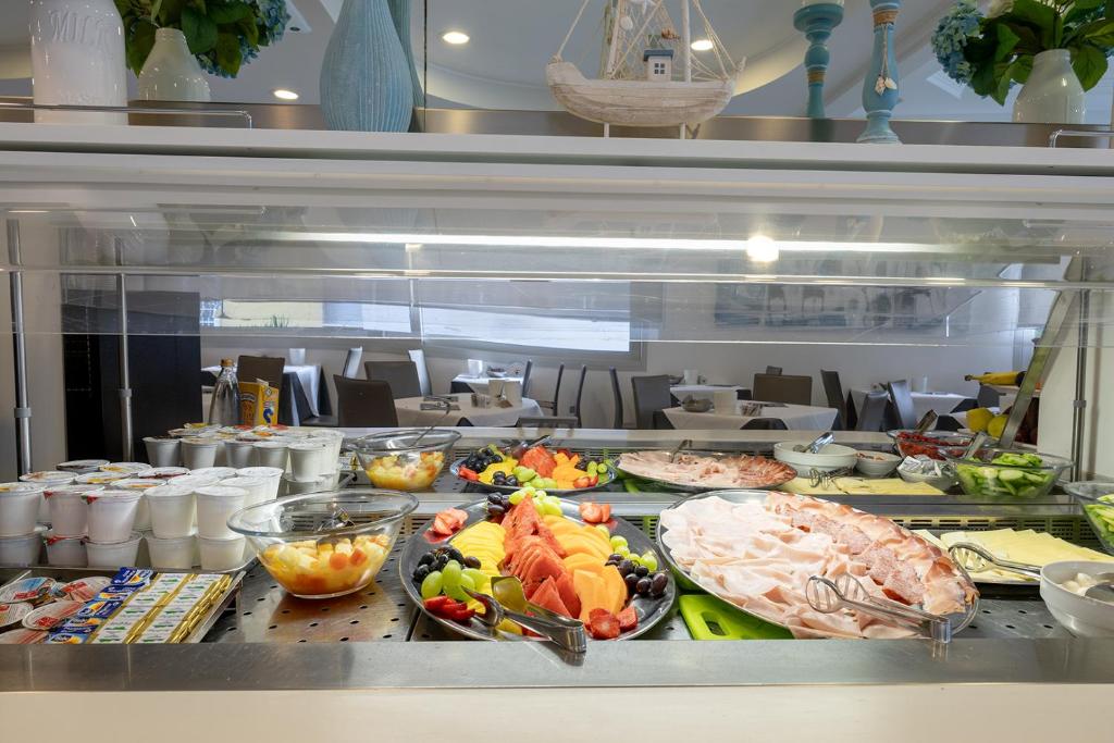 a buffet line with many different types of food at Hotel Bristol in Caorle