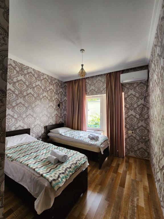 Postel nebo postele na pokoji v ubytování Panorama in KUTAISI