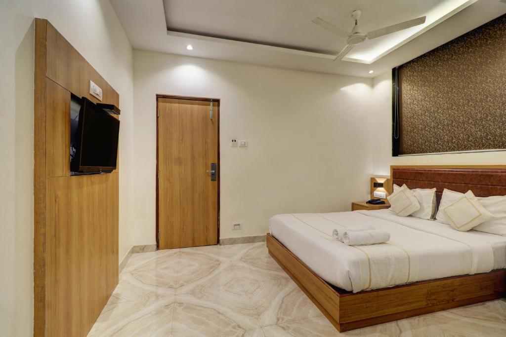 Postel nebo postele na pokoji v ubytování Hotel A K Fort Inn