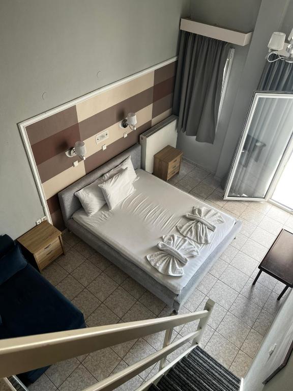 Postel nebo postele na pokoji v ubytování Ellas Hotel