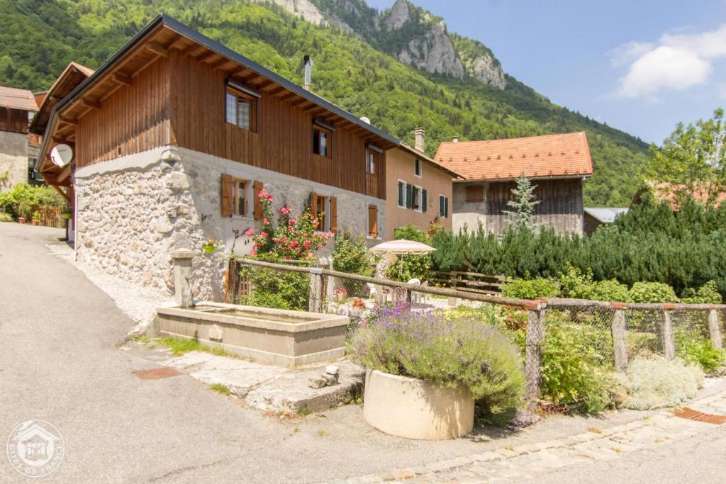 a house with a garden in front of it at Le Balcon de Novel - Chalet en pleine nature in Novel