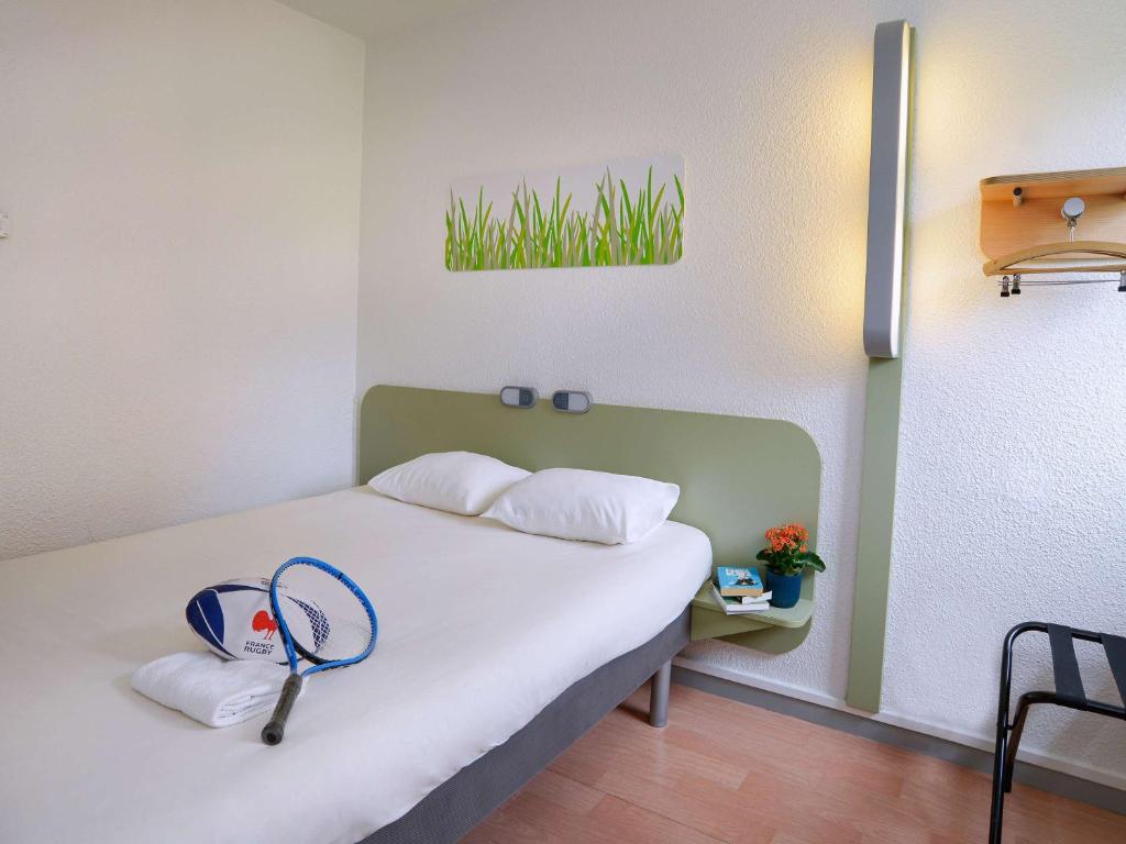 Postel nebo postele na pokoji v ubytování ibis budget Toulouse Centre Gare