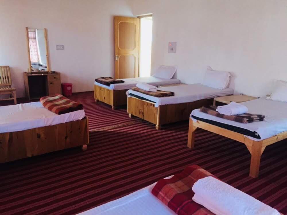 Postel nebo postele na pokoji v ubytování Sponbo Guest House, Leh