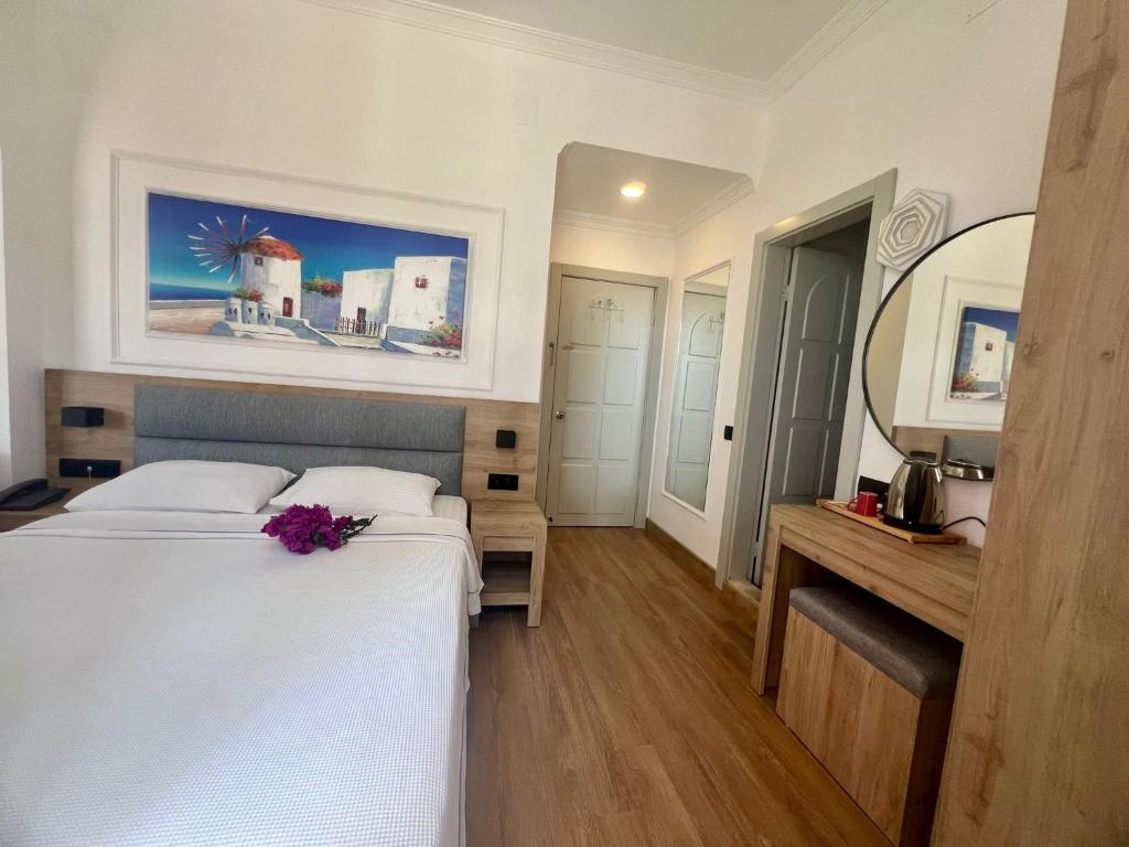 Postel nebo postele na pokoji v ubytování Carikci Hotel