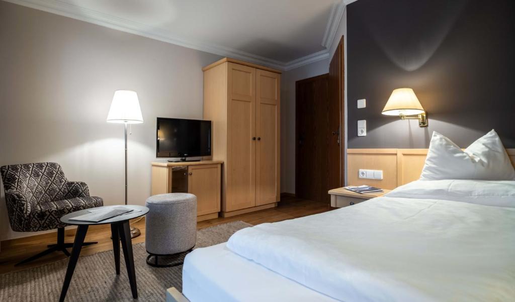 Postel nebo postele na pokoji v ubytování Hotel der Wiesenhof