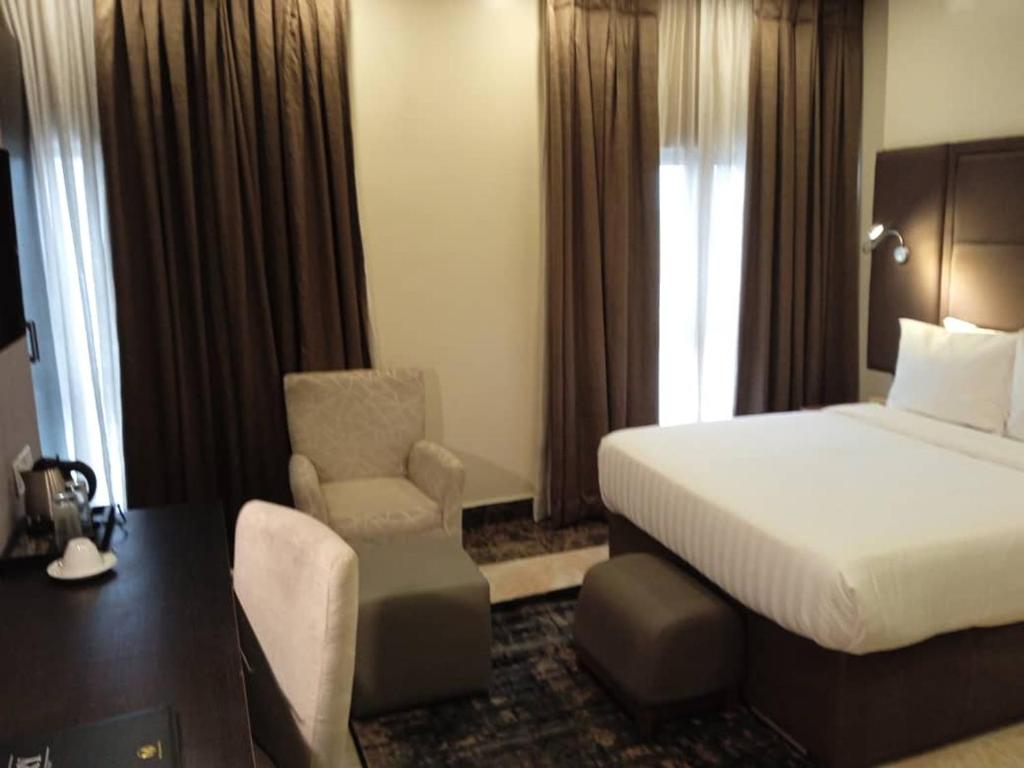 Postel nebo postele na pokoji v ubytování Mulligan Hotel