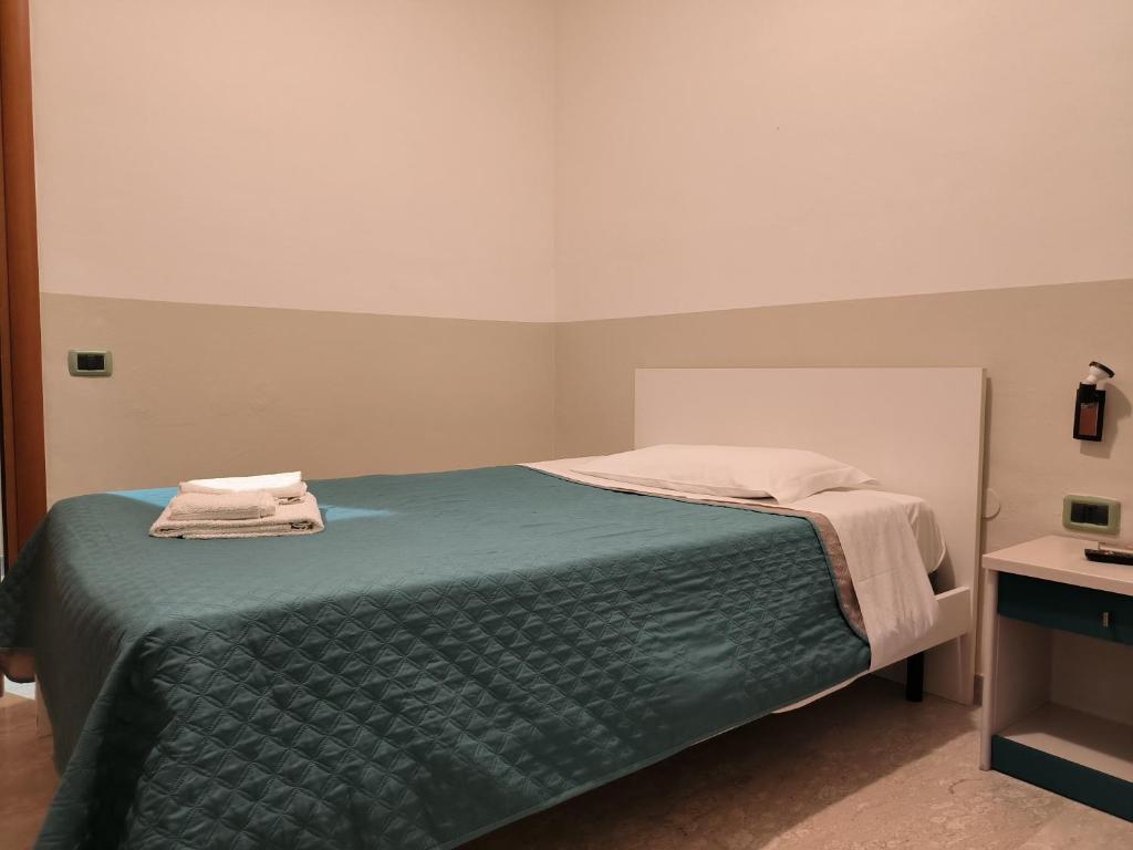Postel nebo postele na pokoji v ubytování Hotel 4 Lampioni