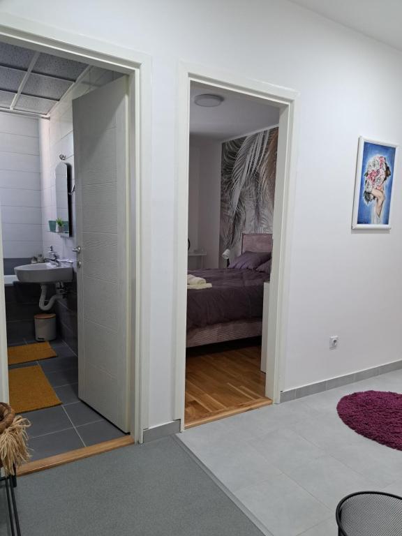 Postel nebo postele na pokoji v ubytování Apartman Iva