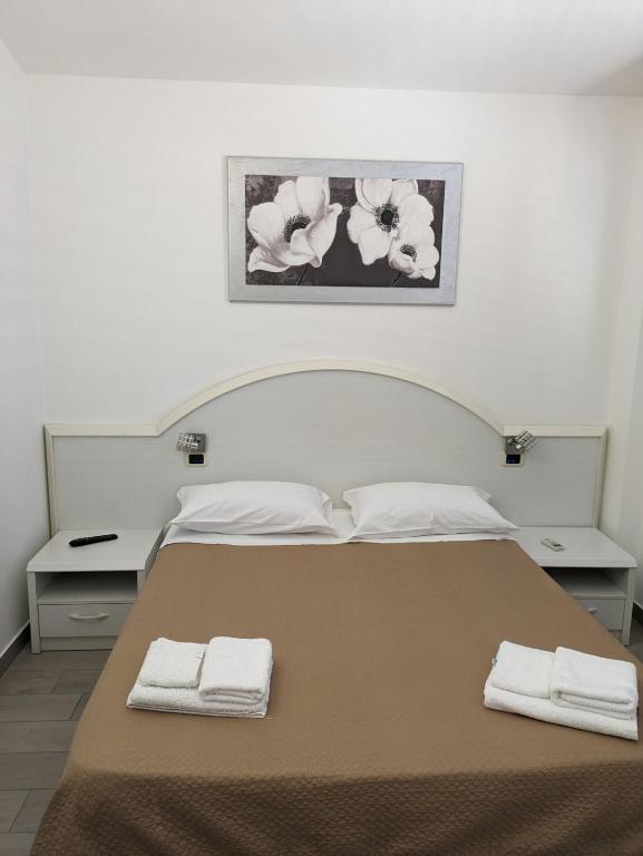 Postel nebo postele na pokoji v ubytování Hotel 4 Lampioni