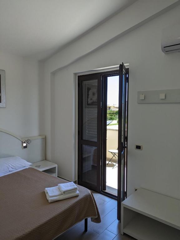 Postel nebo postele na pokoji v ubytování Hotel 4 Lampioni