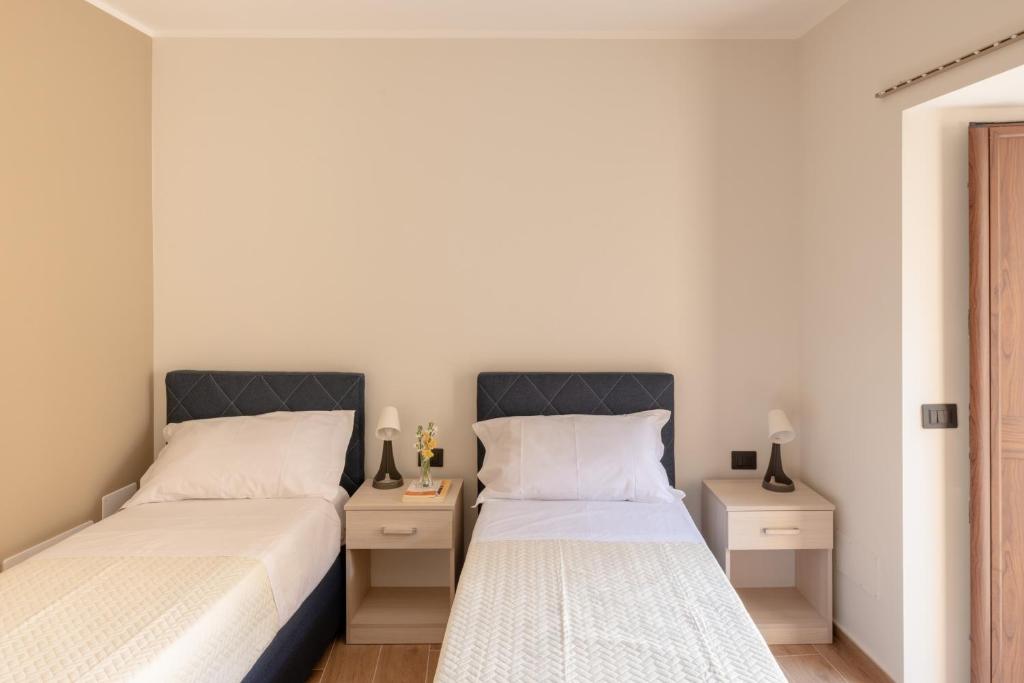 Postel nebo postele na pokoji v ubytování CasaTecla
