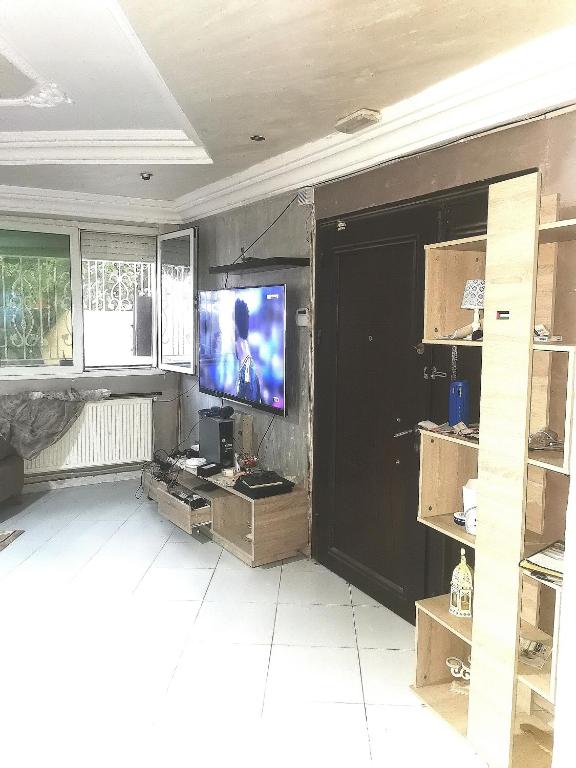 TV a/nebo společenská místnost v ubytování Tiba soliman plage