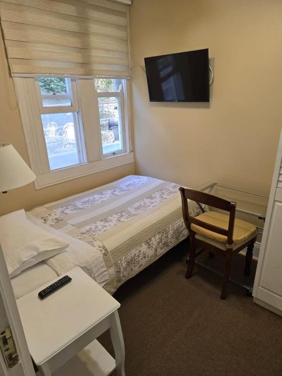 Postel nebo postele na pokoji v ubytování Belle Epoque Hostal